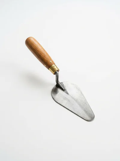 Masonry Trowel With Wooden Handle On White Background