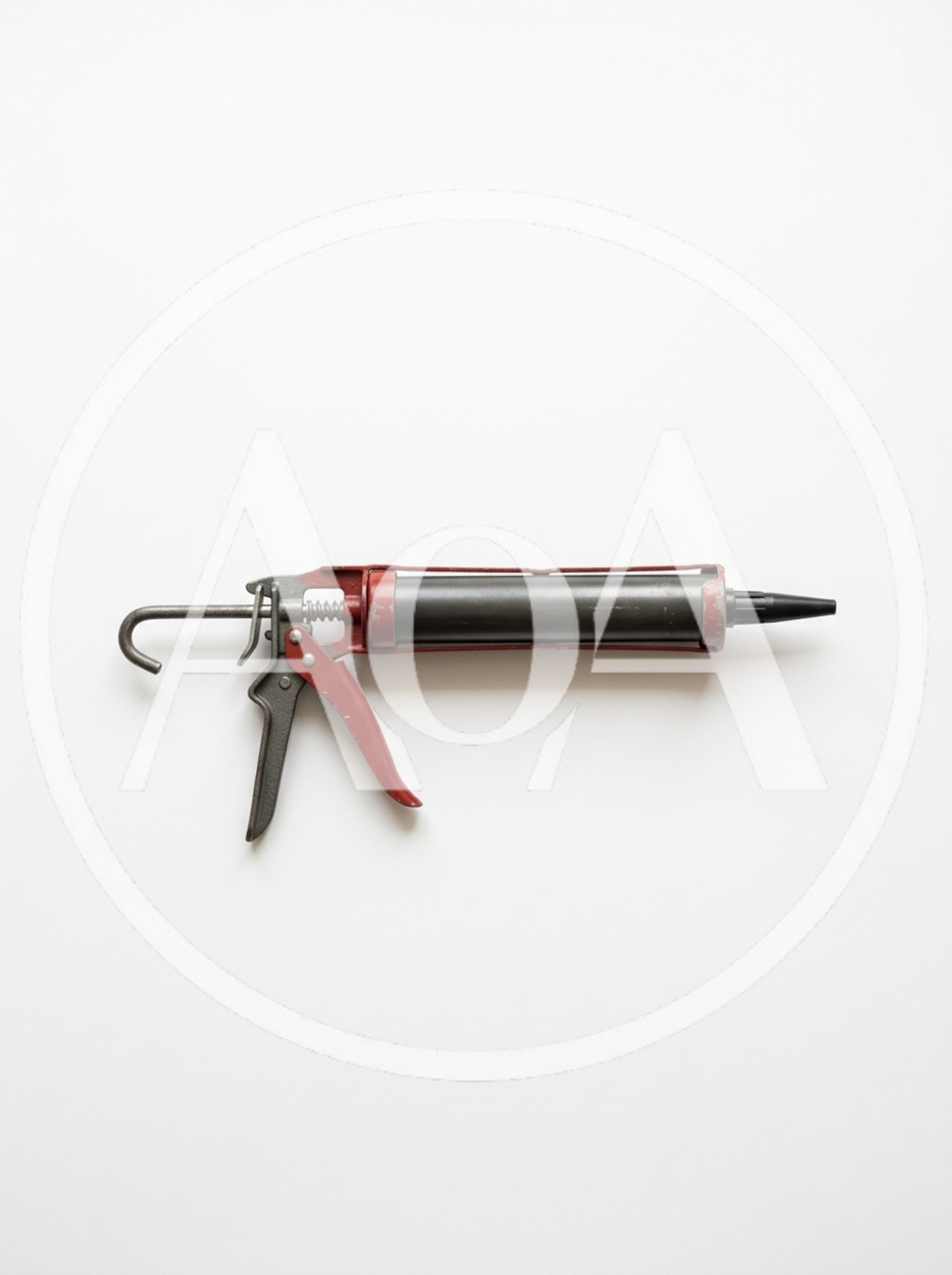 Red Metal Caulking Gun On White Background