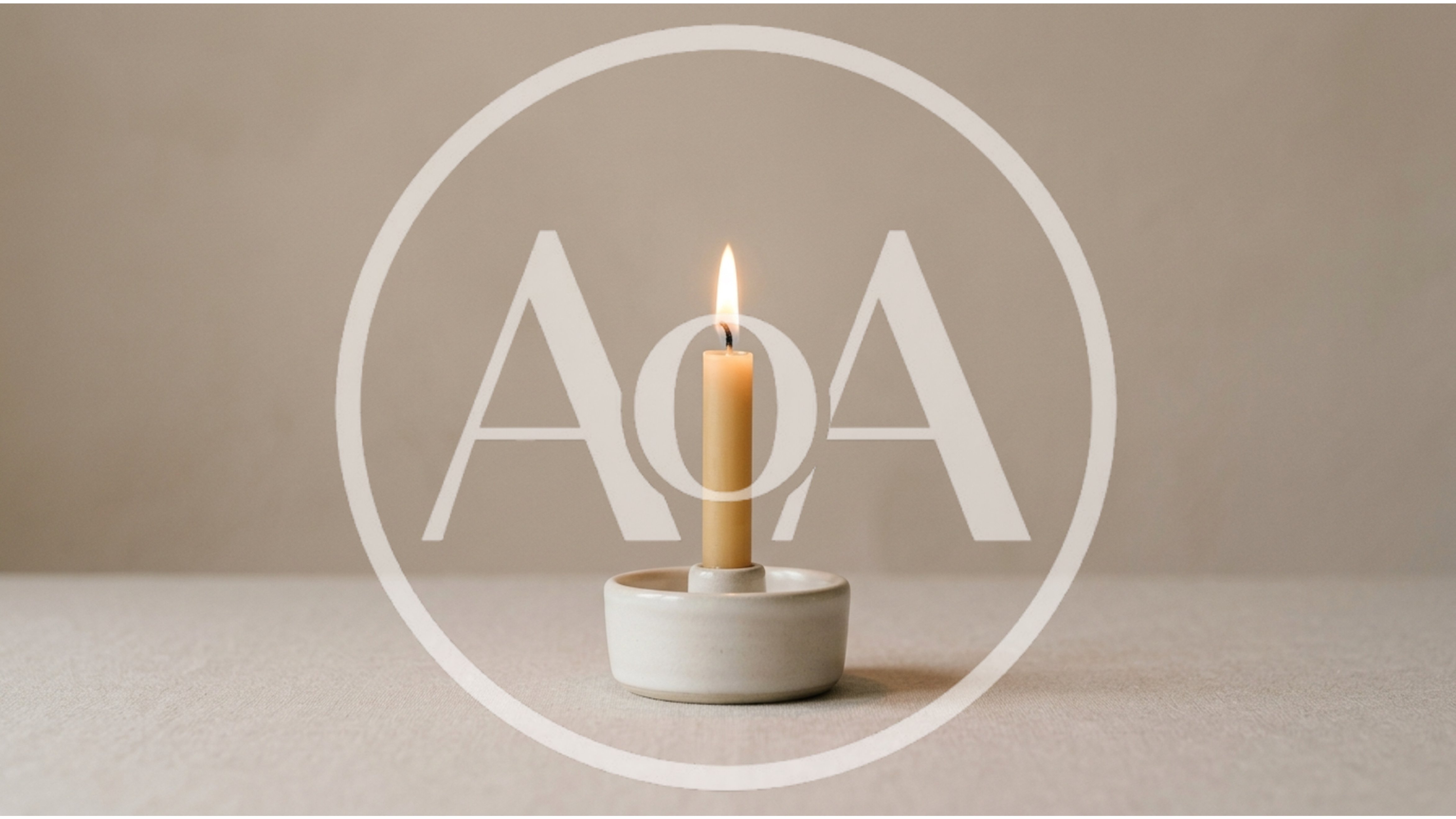 Lit Taper Candle In Minimalist Ceramic Holder