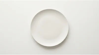 Empty White Ceramic Plate On A Plain Background