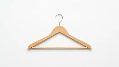 Wooden Clothes Hanger Isolated On White Background