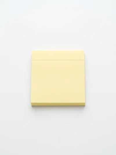 Stack Of Yellow Sticky Notes On White Background
