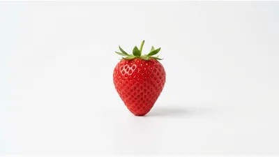 Single Fresh Red Strawberry on White Background