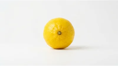 Single Fresh Yellow Lemon on White Background