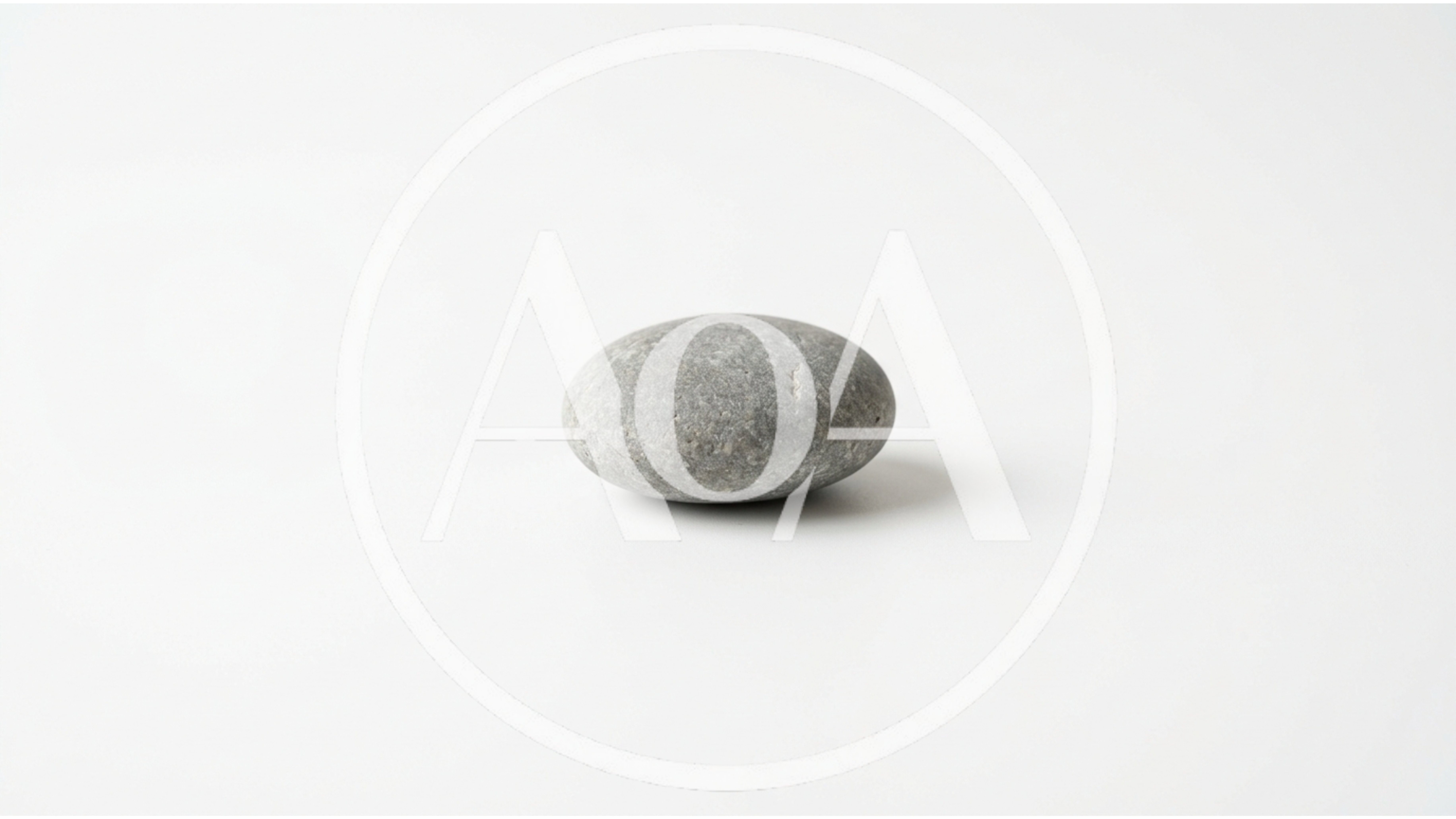 Single Smooth Grey River Stone On White Background