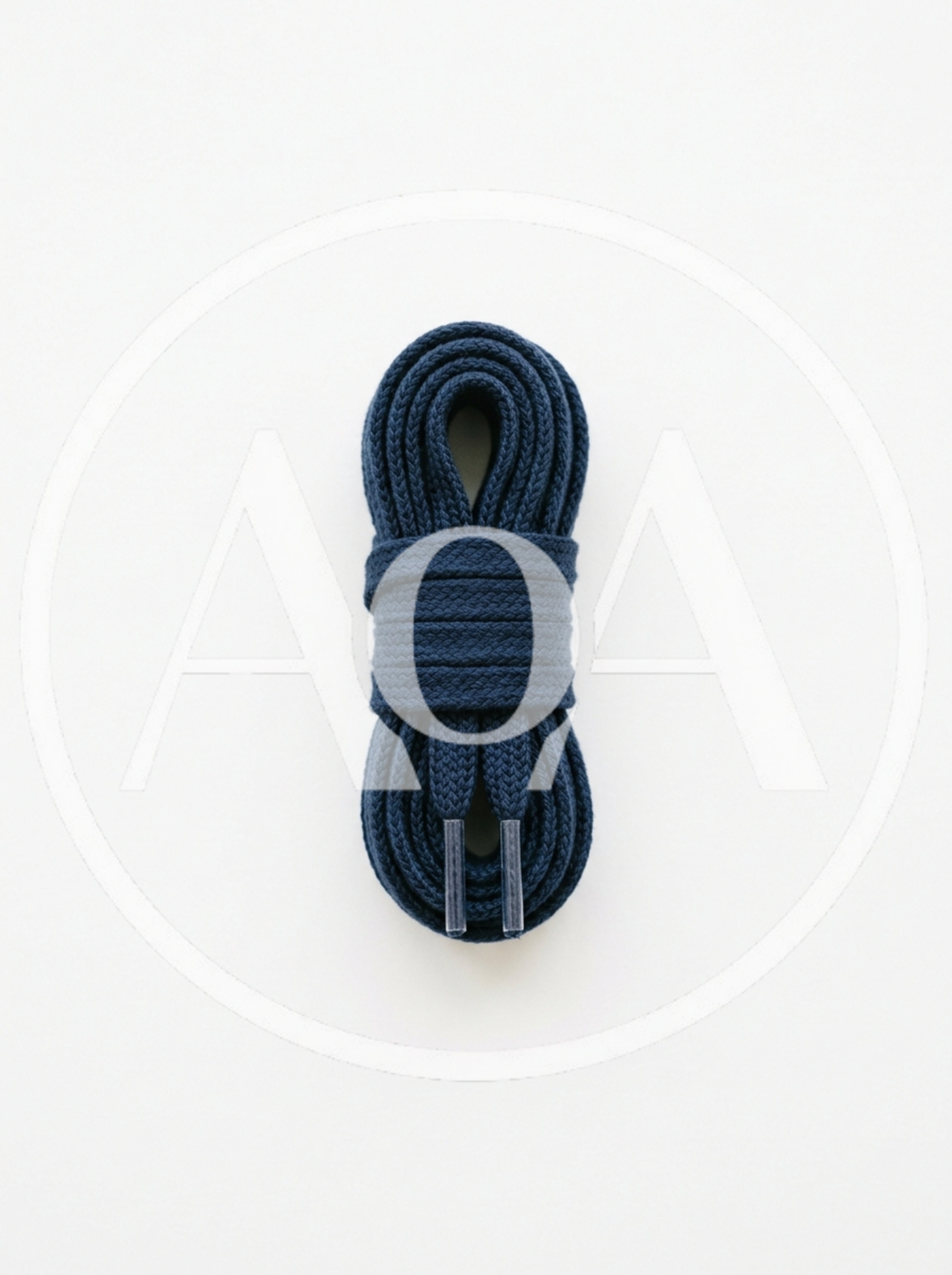 Coiled Navy Blue Shoelaces On White Background