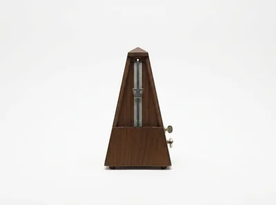 Wooden Mechanical Metronome On White Background