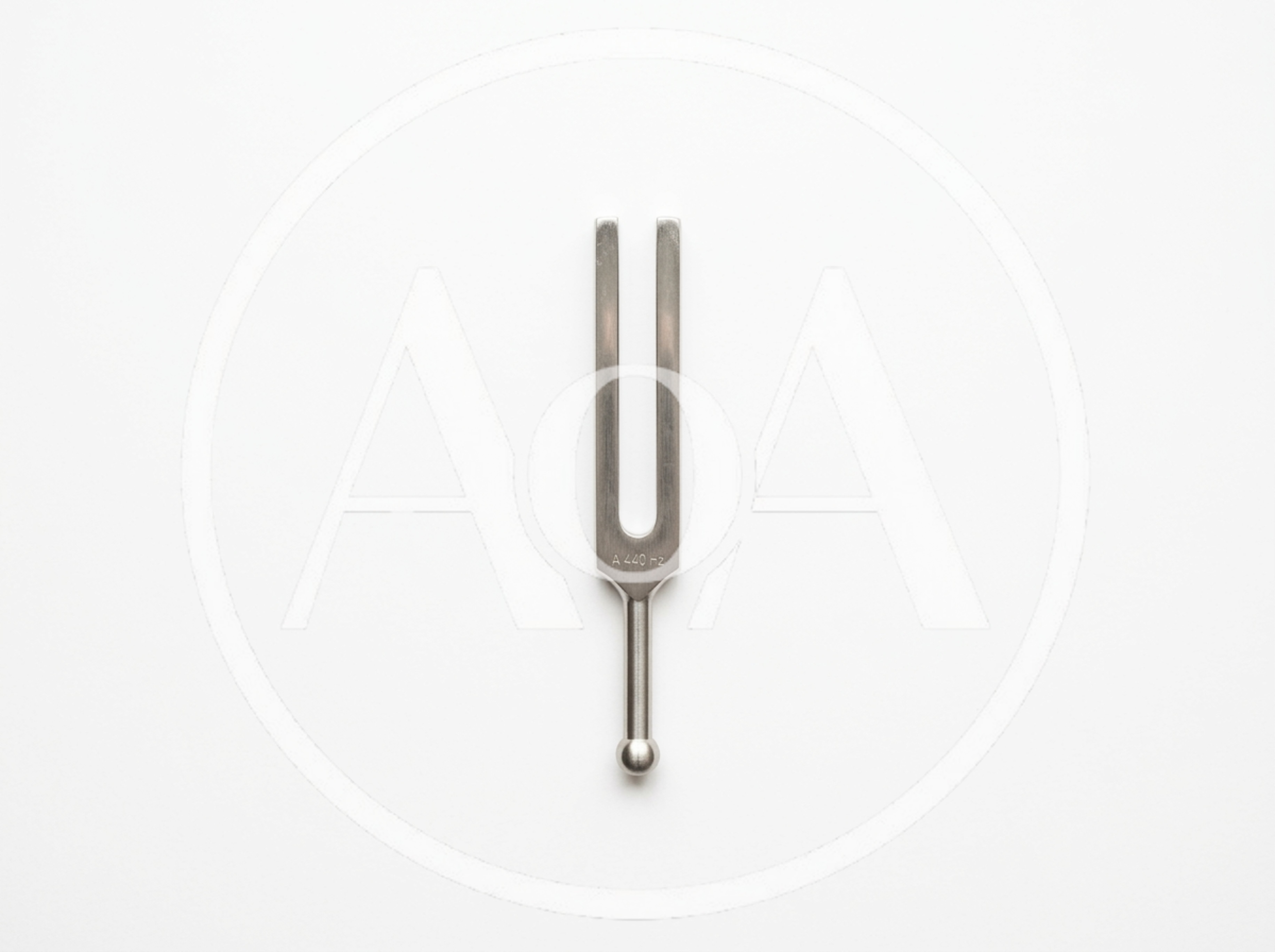 Metal Tuning Fork On White Background