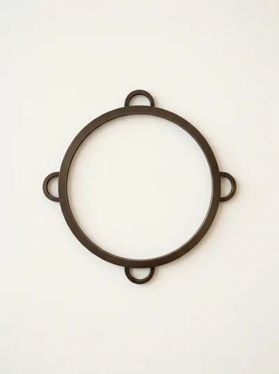 Minimalist Bronze Circular Wall Decor With Four Loops
