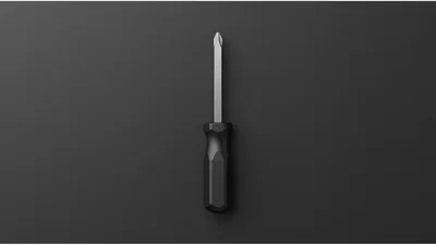 Black Phillips Head Screwdriver On Dark Background