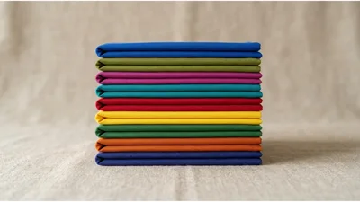 Stack Of Colorful Folded Fabric Squares