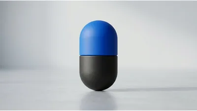 Blue And Black Capsule Pill On Grey Surface