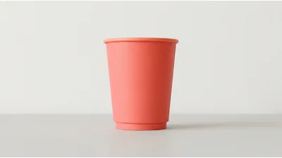 Coral Red Paper Coffee Cup on Neutral Background