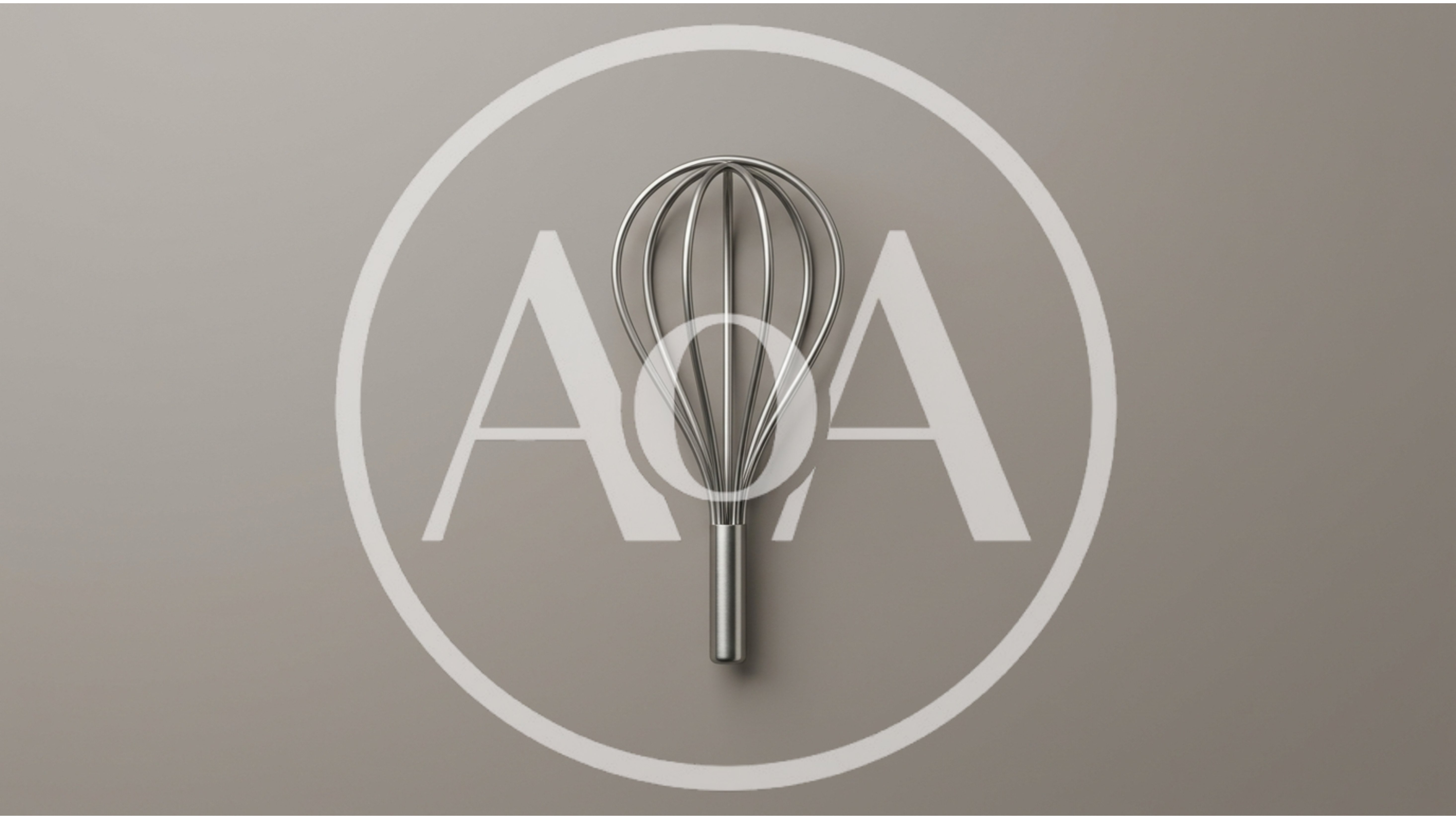 Minimalist Stainless Steel Kitchen Whisk On Grey Background