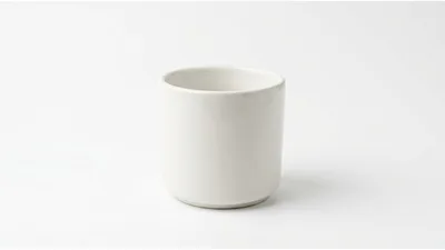 Minimalist White Ceramic Cup On White Background