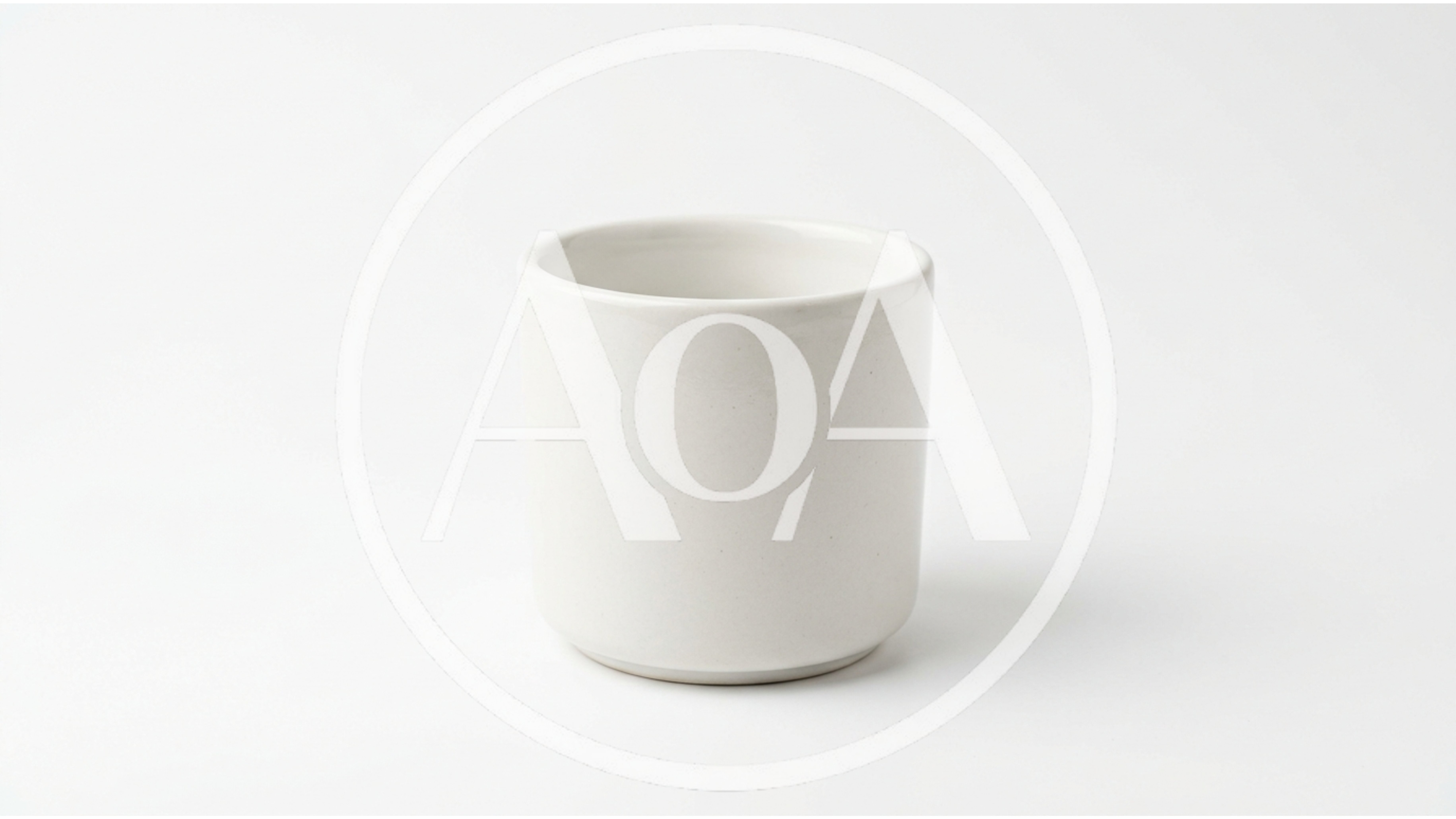 Minimalist White Ceramic Cup On White Background