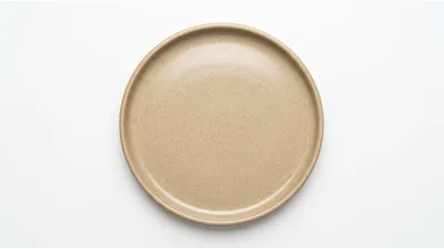 Empty Beige Ceramic Plate On White Background