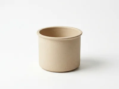 Minimalist Beige Ceramic Pot On White Background
