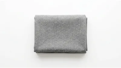 Folded Grey Wool Blanket On White Background