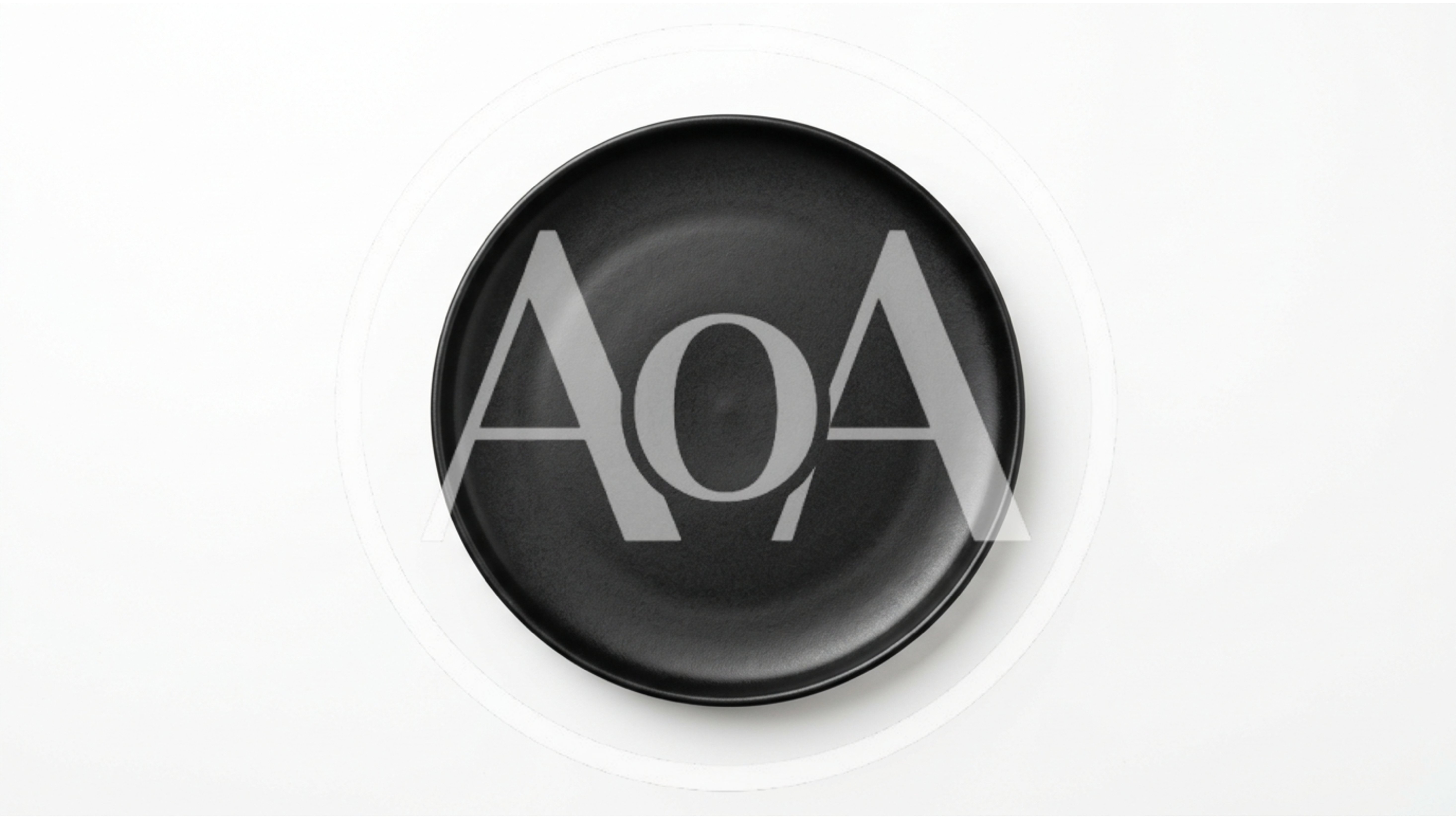 Empty Black Ceramic Plate On White Background