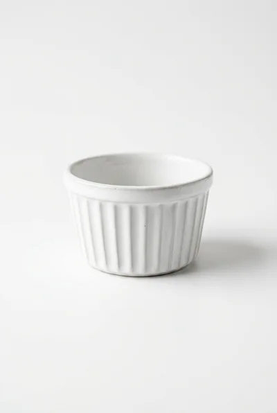 White Ceramic Ramekin Bowl On White Background
