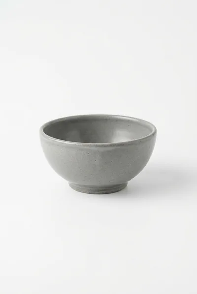 Minimalist Grey Ceramic Bowl on White Background