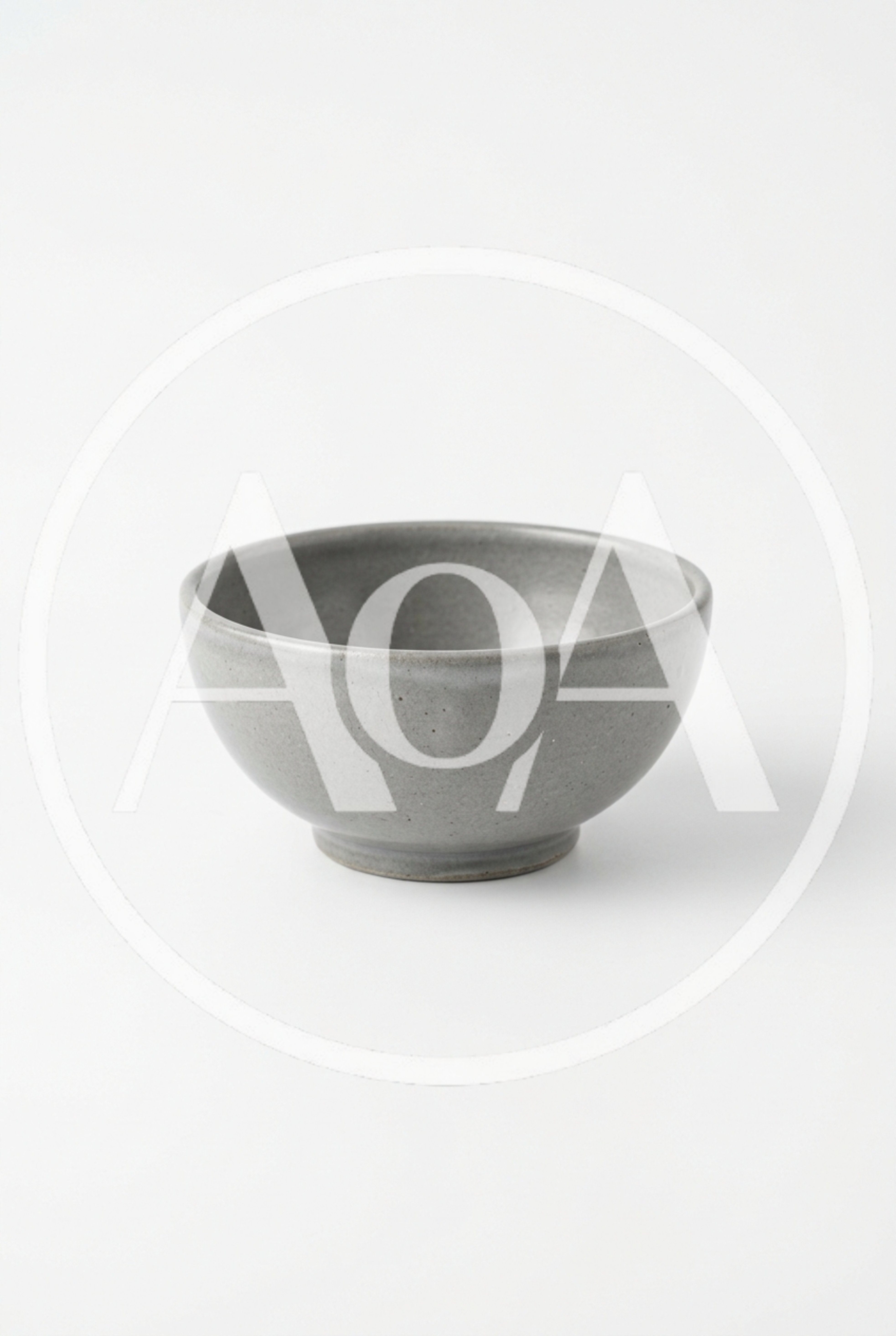 Minimalist Grey Ceramic Bowl on White Background
