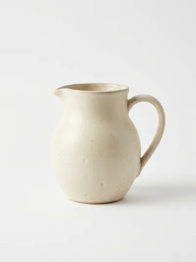 Minimalist Ceramic Pitcher On White Background