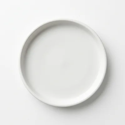 Minimalist White Ceramic Plate On White Background