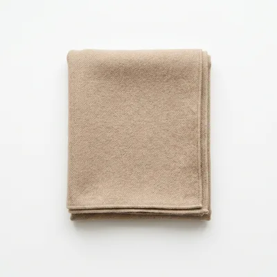 Folded Beige Wool Blanket on White Background
