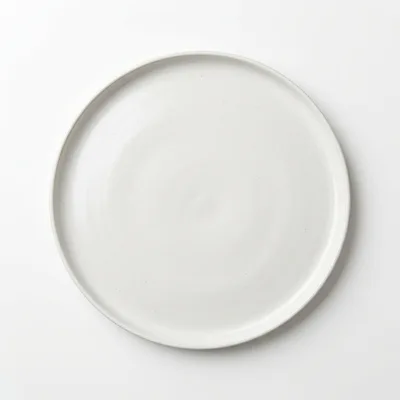 Minimalist White Ceramic Dinner Plate On White Background