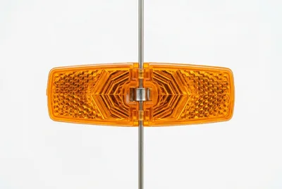 Bicycle Spoke Reflector Mounted On A Metal Spoke
