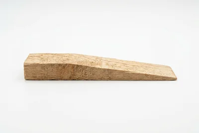 Single Wooden Shim Wedge Isolated On White Background