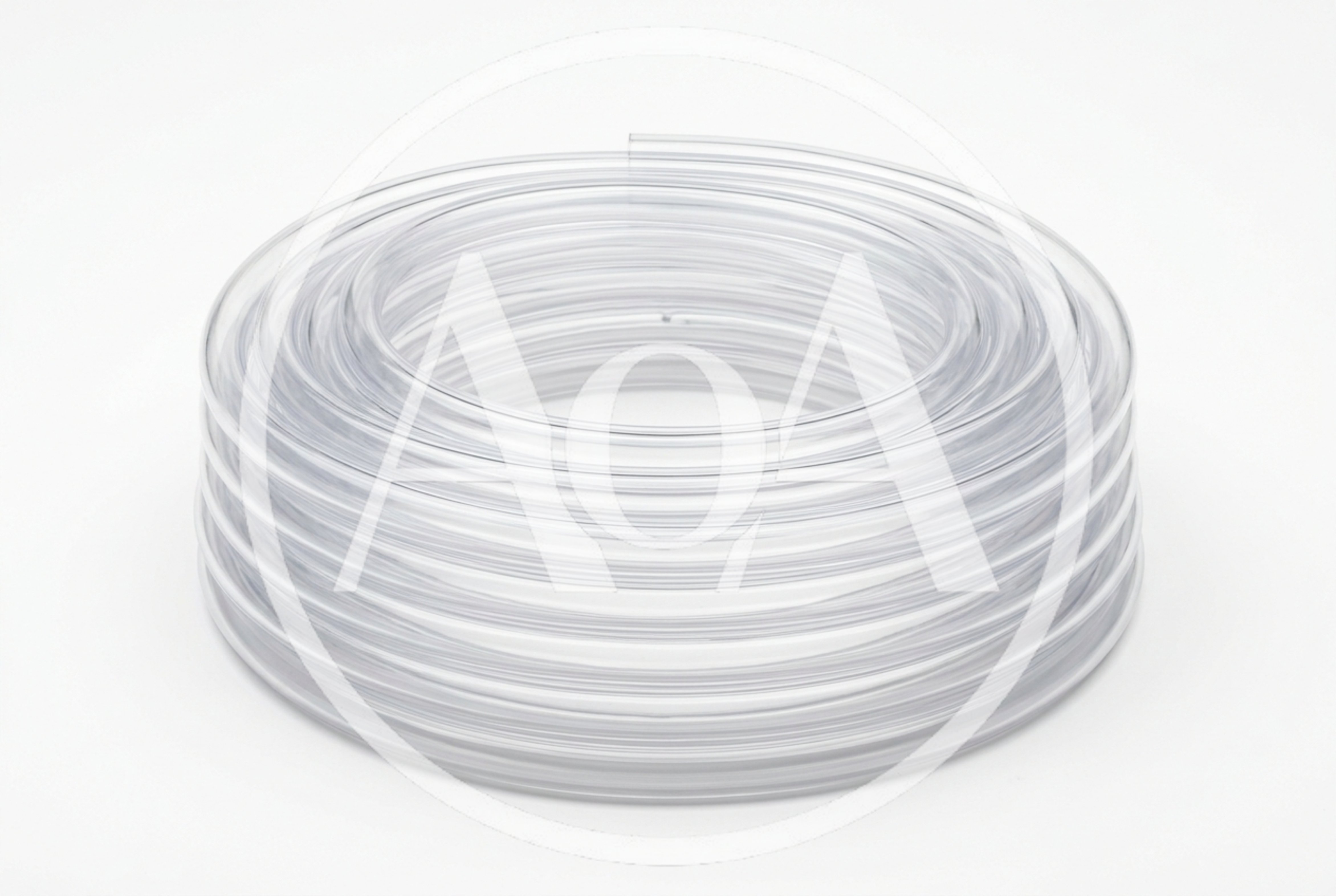 Coiled Clear Plastic Tubing On White Background