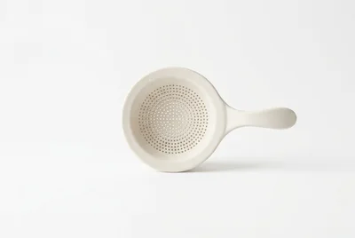 Minimalist Ceramic Tea Strainer On White Background