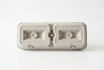 Empty Recycled Paper Egg Carton On White Background
