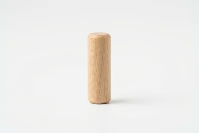 Single Wooden Cylinder Standing On White Background