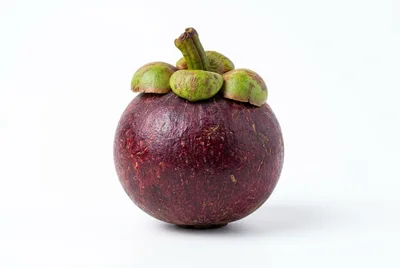 Single Fresh Purple Mangosteen Fruit Isolated On White