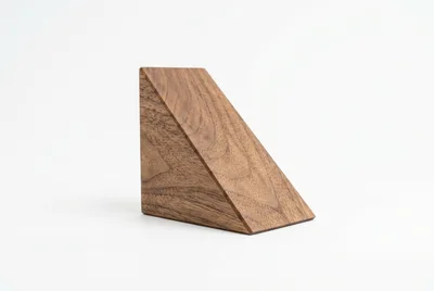 Minimalist Wooden Triangular Block On White Background
