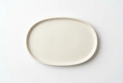Minimalist Oval Ceramic Plate On White Background