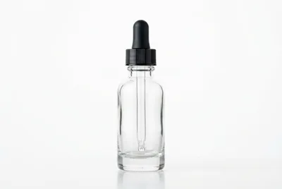 Empty Clear Glass Dropper Bottle On White Background