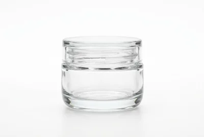 Empty Clear Glass Cosmetic Jar On White Background