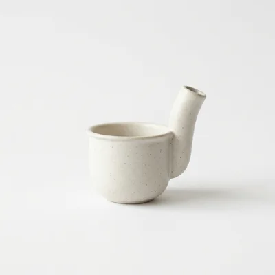 Minimalist Ceramic Pouring Vessel On White Background