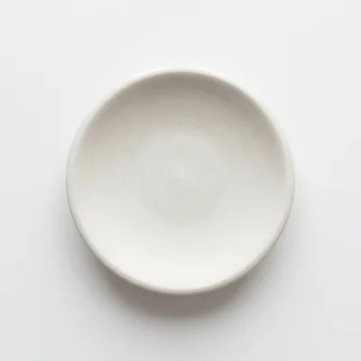 Minimalist White Ceramic Bowl On White Background