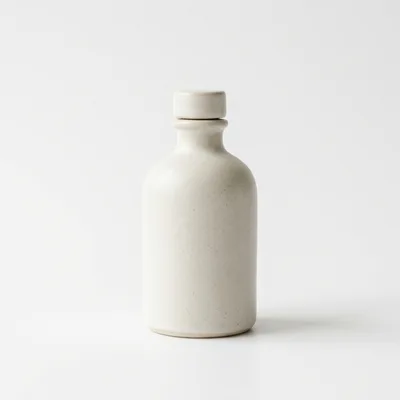 Minimalist Ceramic Bottle On White Background