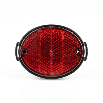 Red Oval Bicycle Reflector Isolated On White Background