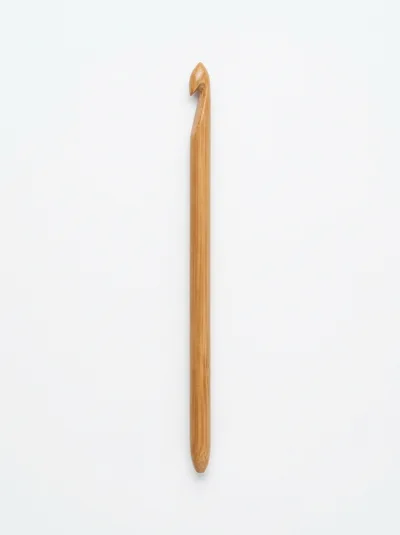 Single Bamboo Crochet Hook On White Background