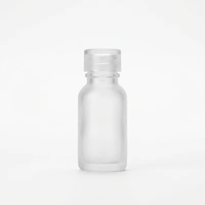 Frosted Glass Essential Oil Bottle On White Background