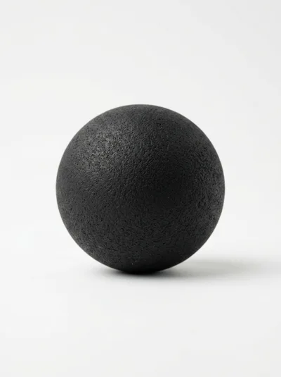 Textured Black Massage Ball On White Background