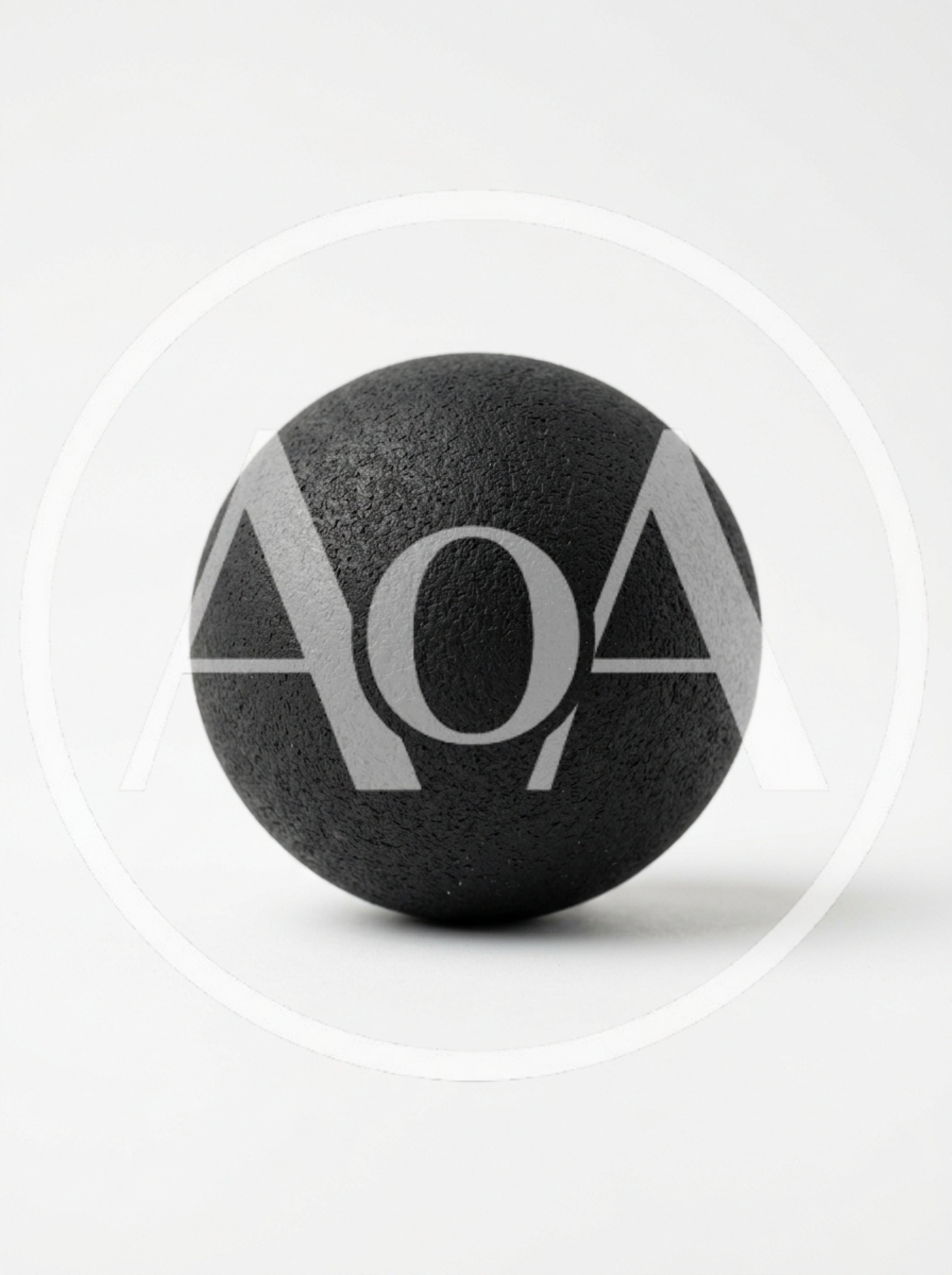Textured Black Massage Ball On White Background